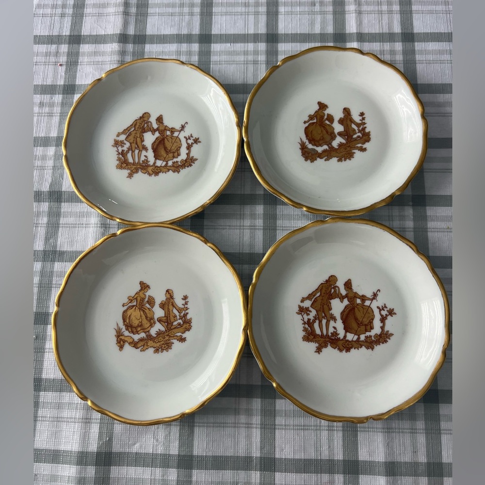 Set of 4 vintage PORCELAINE LIMOGES FRANCE PLATES.